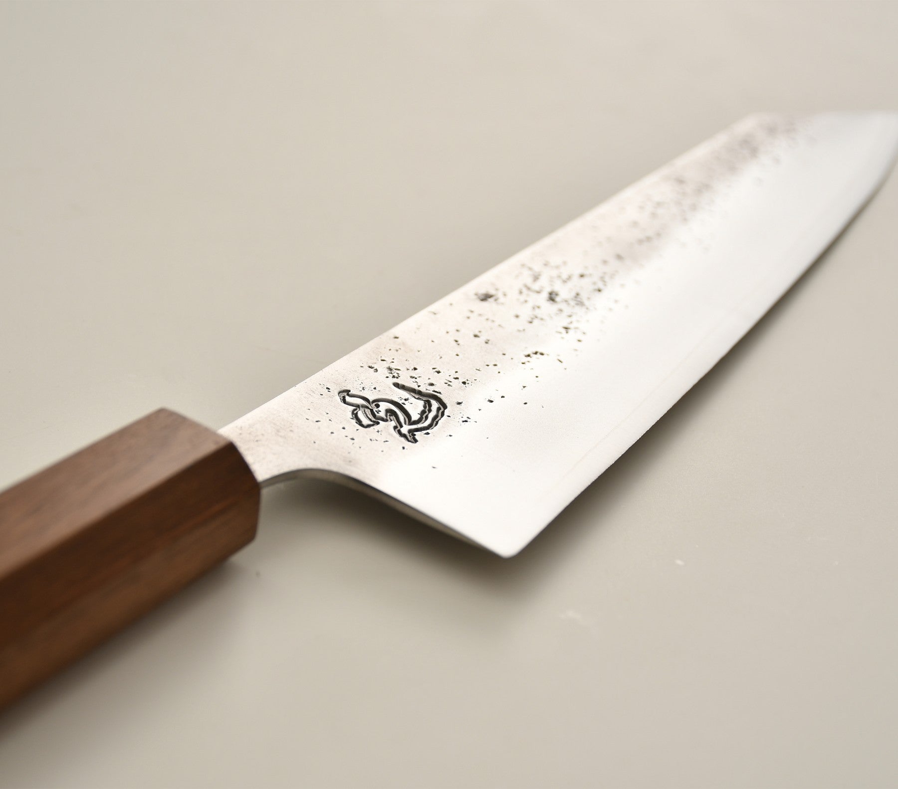 Osantoku Japanese chef knife — forged blade close-up